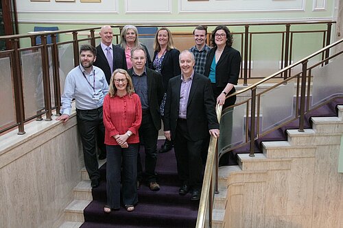 Group of councillors standing on stairs 