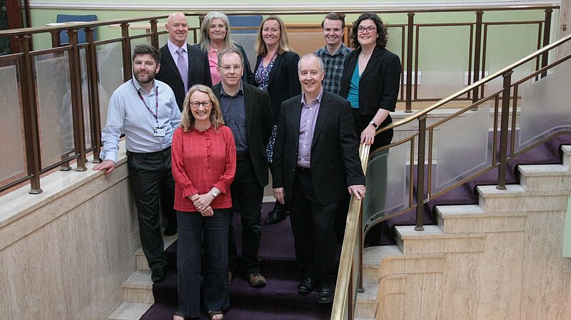 Group of councillors standing on stairs 