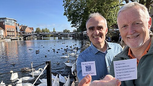 Mark Wilson and Ric Casales smiling near the River Thames